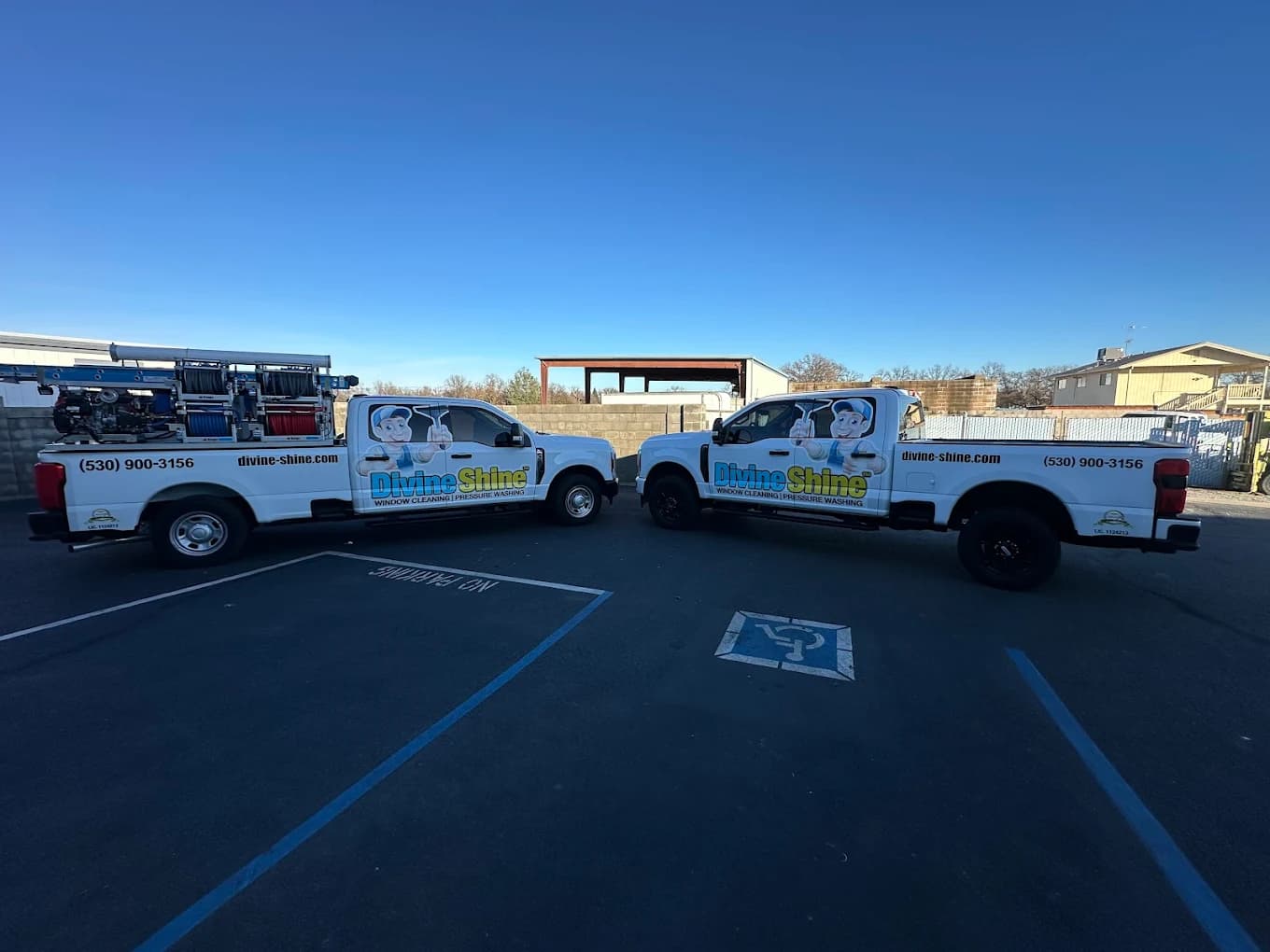 Two branded Divine Shine trucks parked and ready for scheduled service